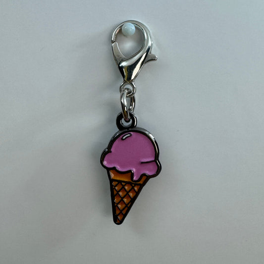 Ice cream cone charm with pink top on a white background