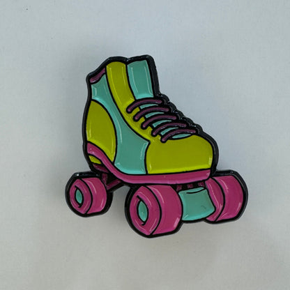 Colorful roller skate pin on a white background